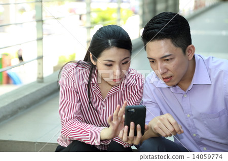 Man woman business executive  outdoor pose relax sit on stair phone 14059774