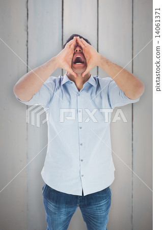 Composite image of shouting casual man standing Composite image of shouting casual man standing 14061371