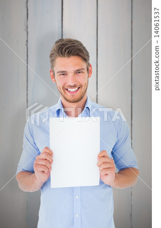 Composite image of handsome young man showing page 14061537