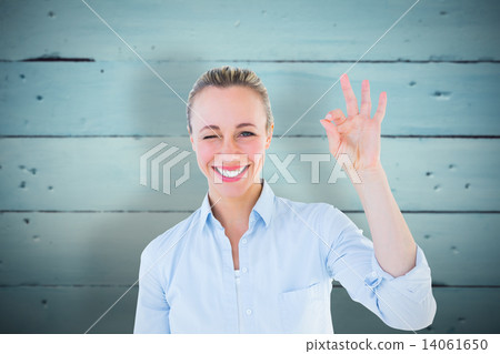Composite image of happy blonde making okay gesture Composite image of happy blonde making okay gesture 14061650