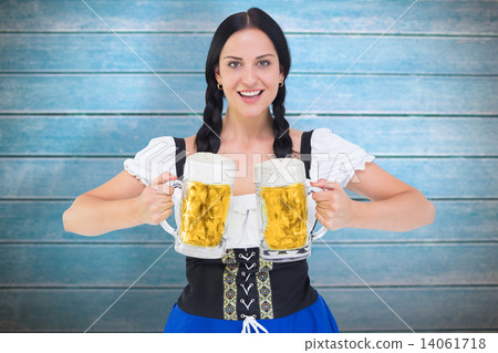 Composite image of pretty oktoberfest girl holding beer tankards 14061718