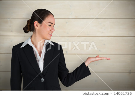 Composite image of happy businesswoman with hand out Composite image of happy businesswoman with hand out 14061726