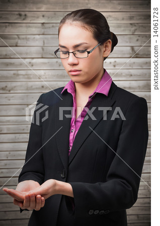 Composite image of businesswomans holding hands out Composite image of businesswomans holding hands out 14061728