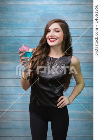 Composite image of brunette with cocktail 14061956