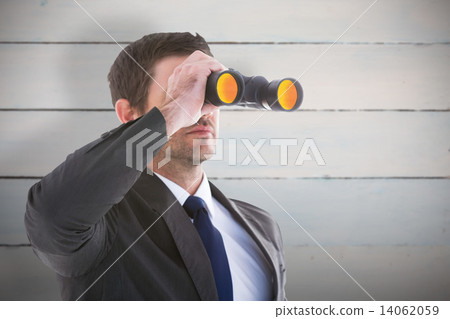 Composite image of young businessman looking through binoculars Composite image of young businessman looking through binoculars 14062059