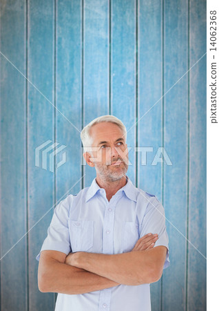 Composite image of thinking man posing with arms crossed Composite image of thinking man posing with arms crossed 14062368