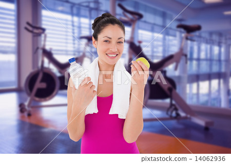 Composite image of fit woman smiling at camera Composite image of fit woman smiling at camera 14062936
