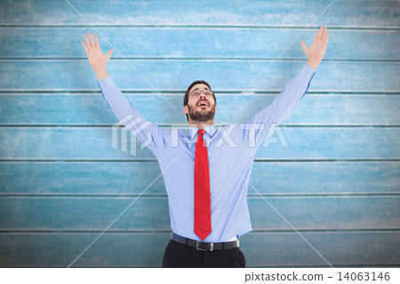 Composite image of happy cheering businessman raising his arms 14063146