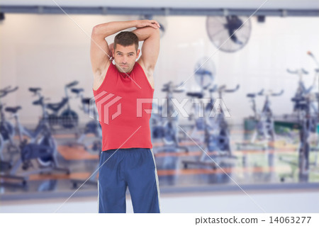 Composite image of fit man stretching his arms 14063277