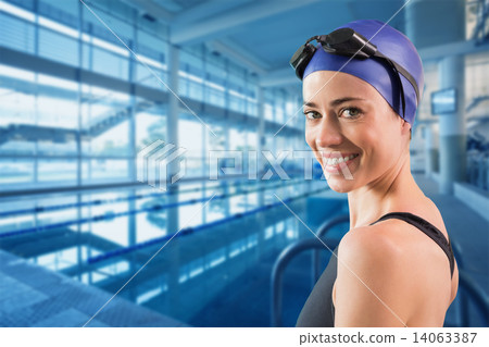 Composite image of fit swimmer standing by the pool smiling at c Composite image of fit swimmer standing by the pool smiling at c 14063387