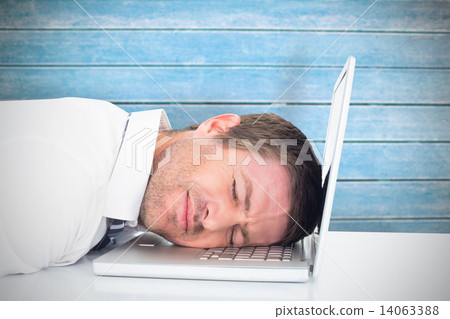 Composite image of tired businessman resting on laptop Composite image of tired businessman resting on laptop 14063388