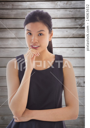 Composite image of thoughtful asian businesswoman Composite image of thoughtful asian businesswoman 14063632