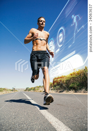 Composite image of athletic man jogging on open road with monito Composite image of athletic man jogging on open road with monito 14063637