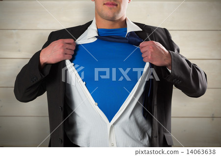 Composite image of businessman opening his shirt superhero style Composite image of businessman opening his shirt superhero style 14063638