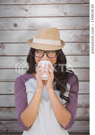 Composite image of brunette with disposable cup Composite image of brunette with disposable cup 14063639