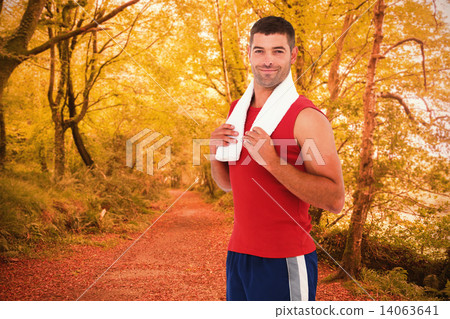 Composite image of fit man smiling at camera Composite image of fit man smiling at camera 14063641