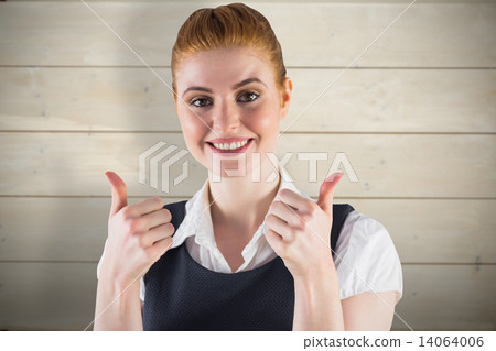 Composite image of redhead businesswoman showing thumbs up 14064006