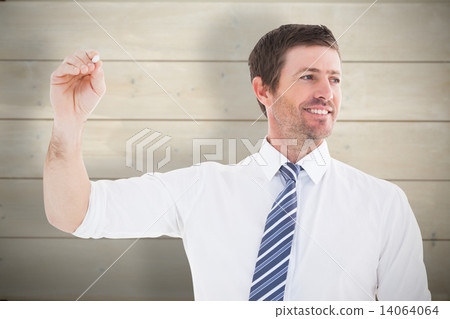 Composite image of smiling businessman writing something with wh 14064064