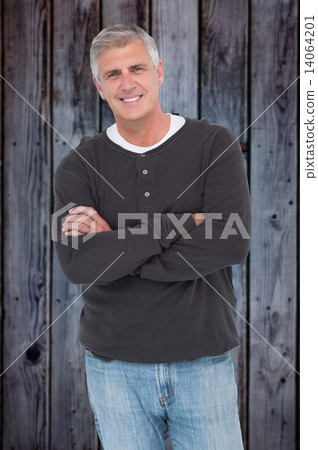Composite image of casual man smiling at camera 14064201