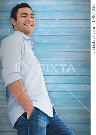 Composite image of smiling casual man standing Composite image of smiling casual man standing 14064380