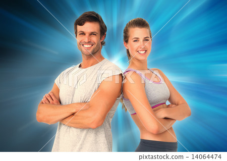 Composite image of portrait of a sporty young couple with arms c Composite image of portrait of a sporty young couple with arms c 14064474