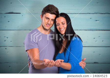 Composite image of young couple holding out hands Composite image of young couple holding out hands 14064523
