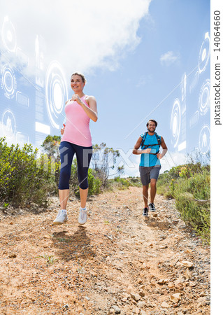 Composite image of fit attractive couple jogging down mountain t Composite image of fit attractive couple jogging down mountain t 14064660