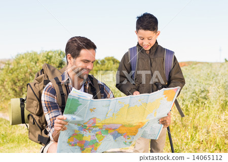 Father and son on a hike together Father and son on a hike together 14065112