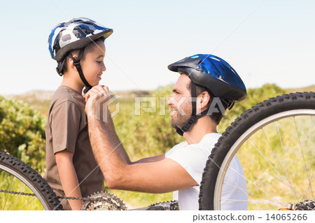 Father and son on a bike ride Father and son on a bike ride 14065266