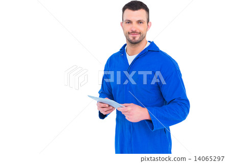 Happy mechanic pointing on digital tablet Happy mechanic pointing on digital tablet 14065297
