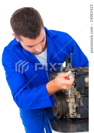 Male mechanic repairing car engine 14065425