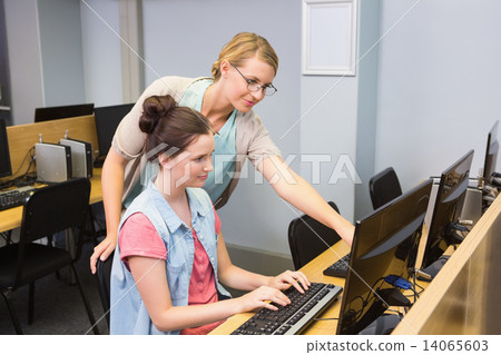 Students working on computer together Students working on computer together 14065603