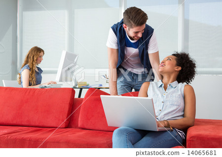 Creative team using laptop 14065681