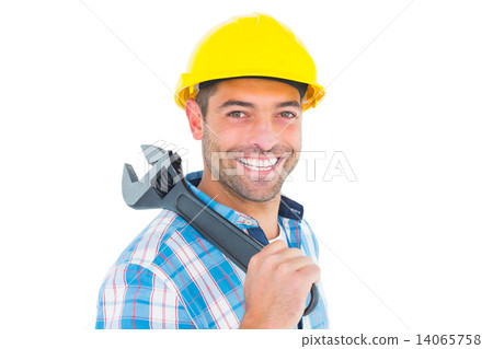 Smiling manual worker holding adjustable spanner 14065758