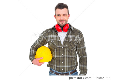 Handyman with earmuffs holding helmet 14065982