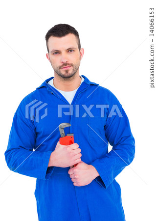 Smiling male mechanic holding monkey wrench 14066153