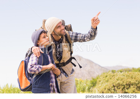 Father and son hiking in the mountains 14066256