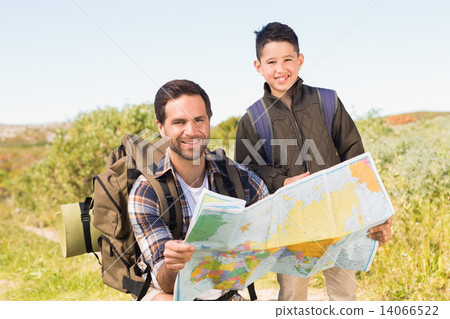 Father and son on a hike together Father and son on a hike together 14066522