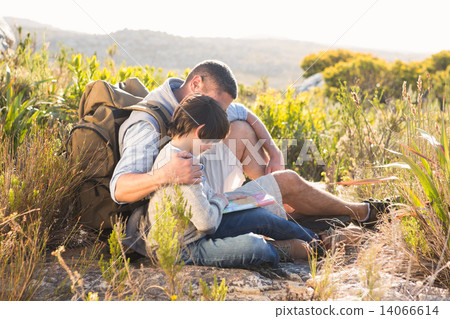 Father and son hiking in the mountains 14066614