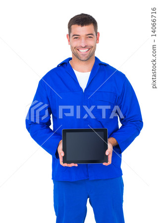 Smiling male mechanic showing digital tablet Smiling male mechanic showing digital tablet 14066716
