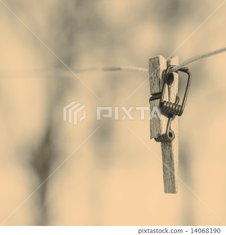 Broken clothespin on the wire 14068190