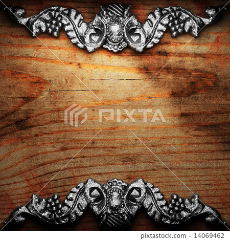 iron ornament on wood 14069462