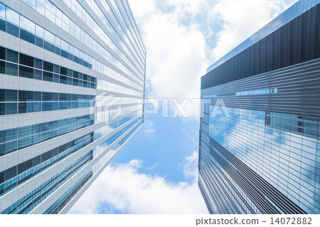 High-rise building with blue sky reflected 14072882