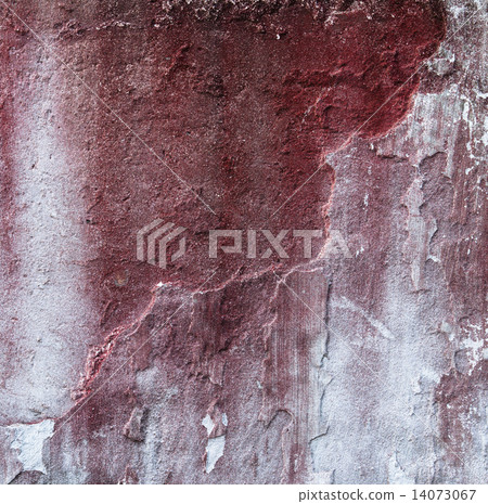 Broken concrete wall and faded red paint 14073067