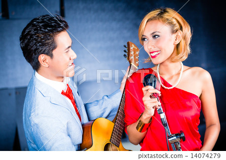 Asian professional band recording song in studio Asian professional band recording song in studio 14074279