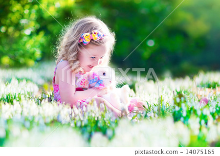 Little girl playing with a rabbit 14075165