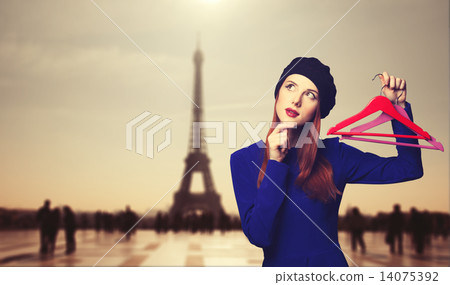 women in blue dress with hanger 14075392