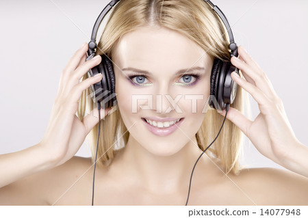 Beautiful girl is listen to the music Beautiful girl is listen to the music 14077948