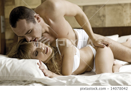 young couple in bed young couple in bed 14078042