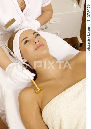 Young woman receiving laser therapy Young woman receiving laser therapy 14078076